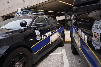 Police cars are seen outside of the Baltimore City Police Headquarters