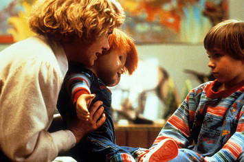 Actress Catherine Hicks and child actor Alex Vincent with Chucky