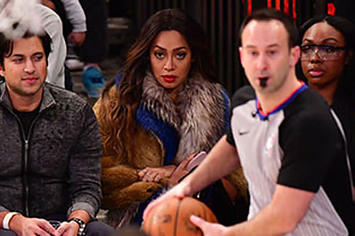 Lala Anthony stares down Carmelo at an OKC NYK game.
