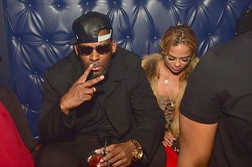 R. Kelly and Halle Calhoun attend a Party at Amora Lounge