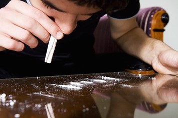 A person using cocaine.