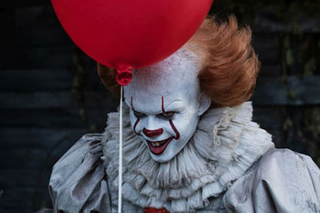 Pennywise holding a balloon in 'It'