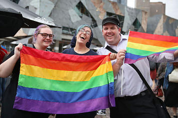 People celebrate Australia officially legalizing same sex marriage.