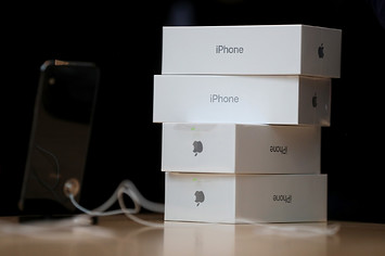 Boxes of the new iPhone X sit on a table at an Apple Store
