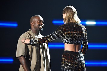 Kanye West and Taylor Swift greet one another.