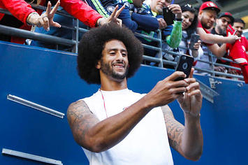 Colin Kaepernick takes a selfie with a 49ers fan.