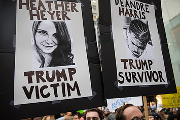 Heather Heyer and Deandre Harris posters at an anti Trump demonstration outside of Trump Tower