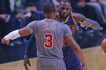 Dwyane Wade and LeBron James embrace during a Bulls Cavs game.
