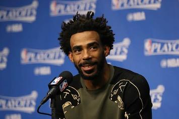 Mike Conley speaks with reporters after a playoff game.