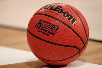 Basketball with NCAA branding.