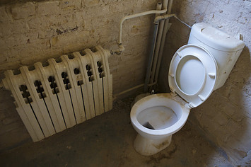 Photo of a dirty and dusty toilet