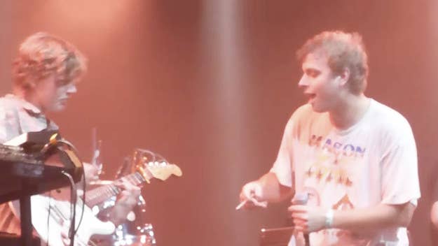 An audience member held up a sign that said "Hey Mac, may I play a song with you?"