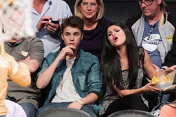 Selena Gomez and Justin Bieber attend basketball game together.