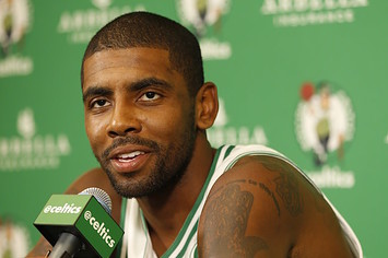 Kyrie Irving talks to the media during media day.