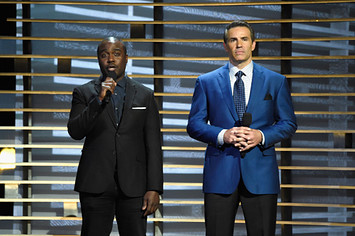 Marshall Faulk and Kurt Warner speak onstage at A+E Networks 'Shining A Light' concert