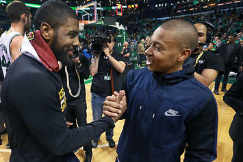 Kyrie Irving and Isaiah Thomas exchange a handshake.