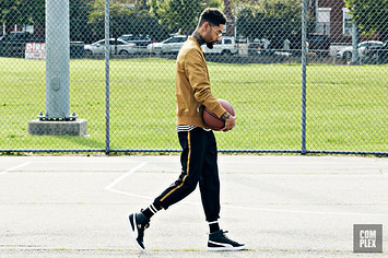 PnB Rock wearing the PUMA Clyde Mid Foil Sneakers