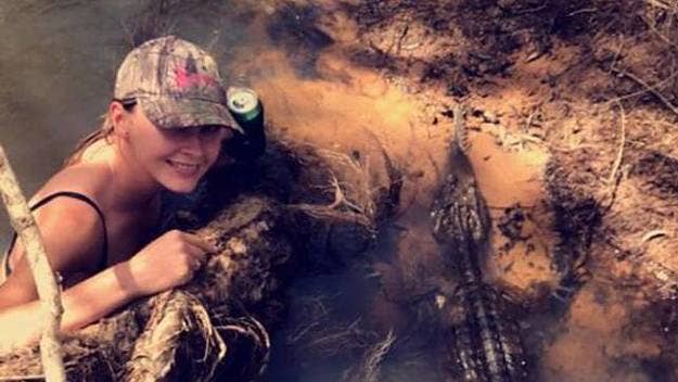 The Queenslander casually took a photo with a wild croc while holding her beer, and posted it to Facebook.