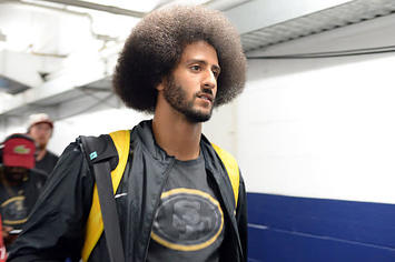 Ex 49ers quarterback Colin Kaepernick arrives with teammates before the game against the Chargers