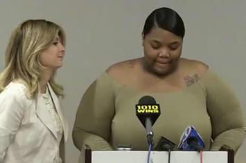 A woman who filed a lawsuit against Usher holds a press conference.