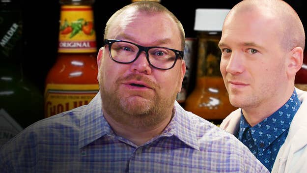 Watch Hot Ones superfan Brett Baker grill host Sean Evans with hot questions and even hotter wings. 