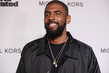 Kyrie Irving on the red carpet at a Sports Illustrated event.