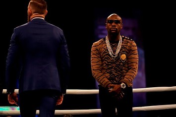 Floyd Mayweather and Conor McGregor square off in the ring.