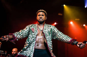 Usher performs on stage
