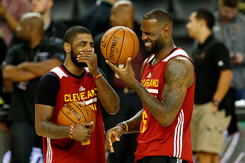 LeBron James and Kyrie Irving share a laugh.