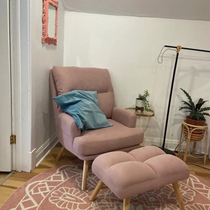 The accent chair and ottoman in the pink linen color