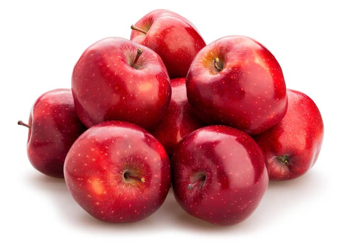 a pile of red delicious apples