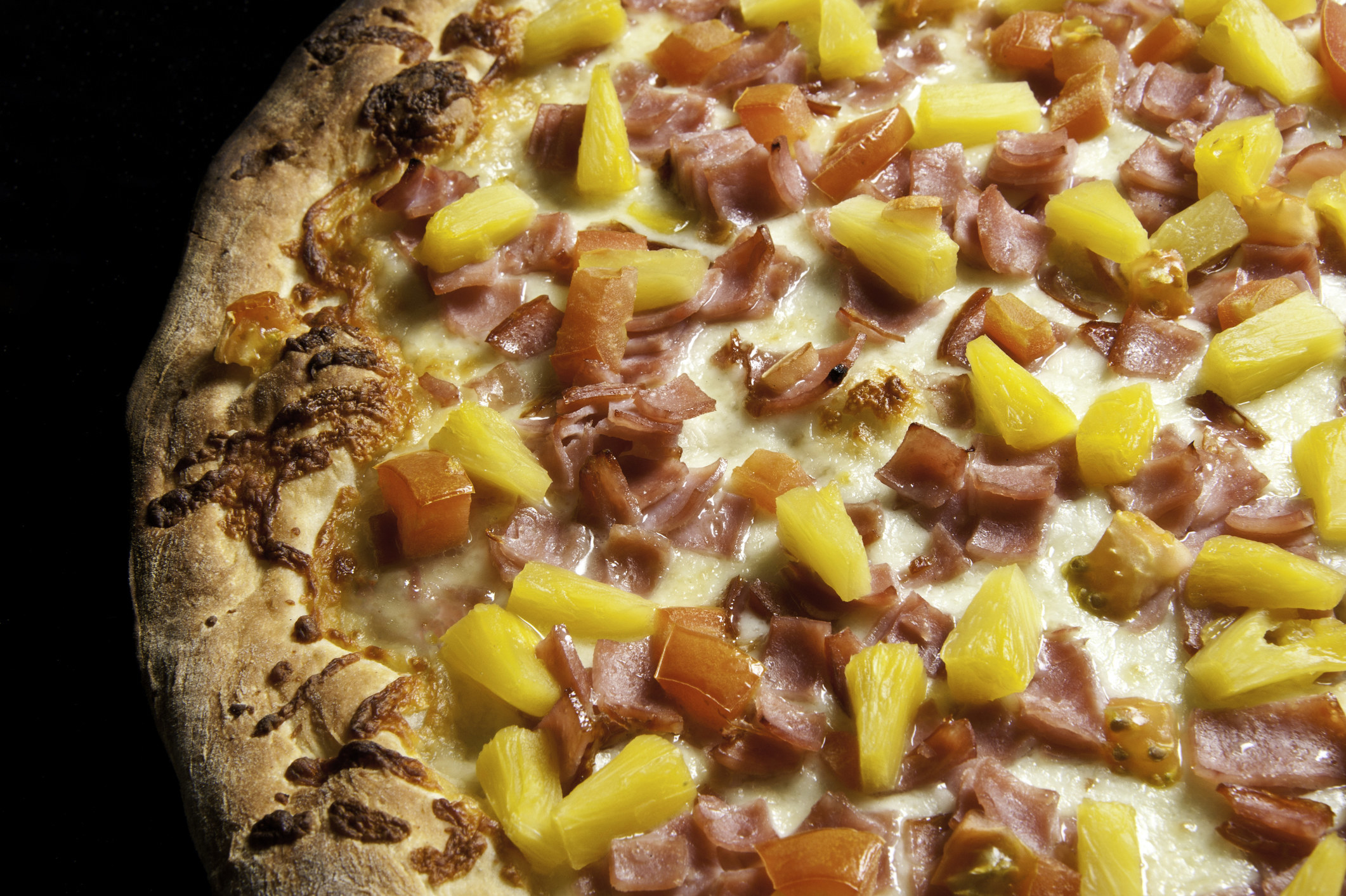 a ham and pineapple pizza