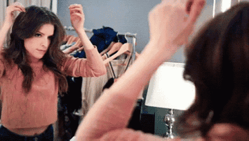 Anna Kendrick dancing in the mirror.