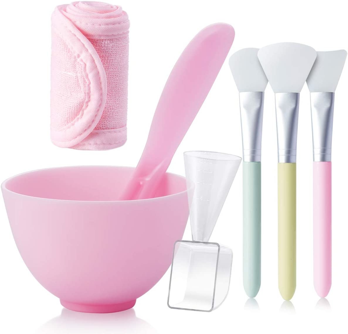 the whole bowl and spatula set in front of a plain backfround