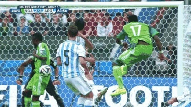 A Nigerian soccer player broke his arm during the World Cup today when he got hit by his teammate's shot.