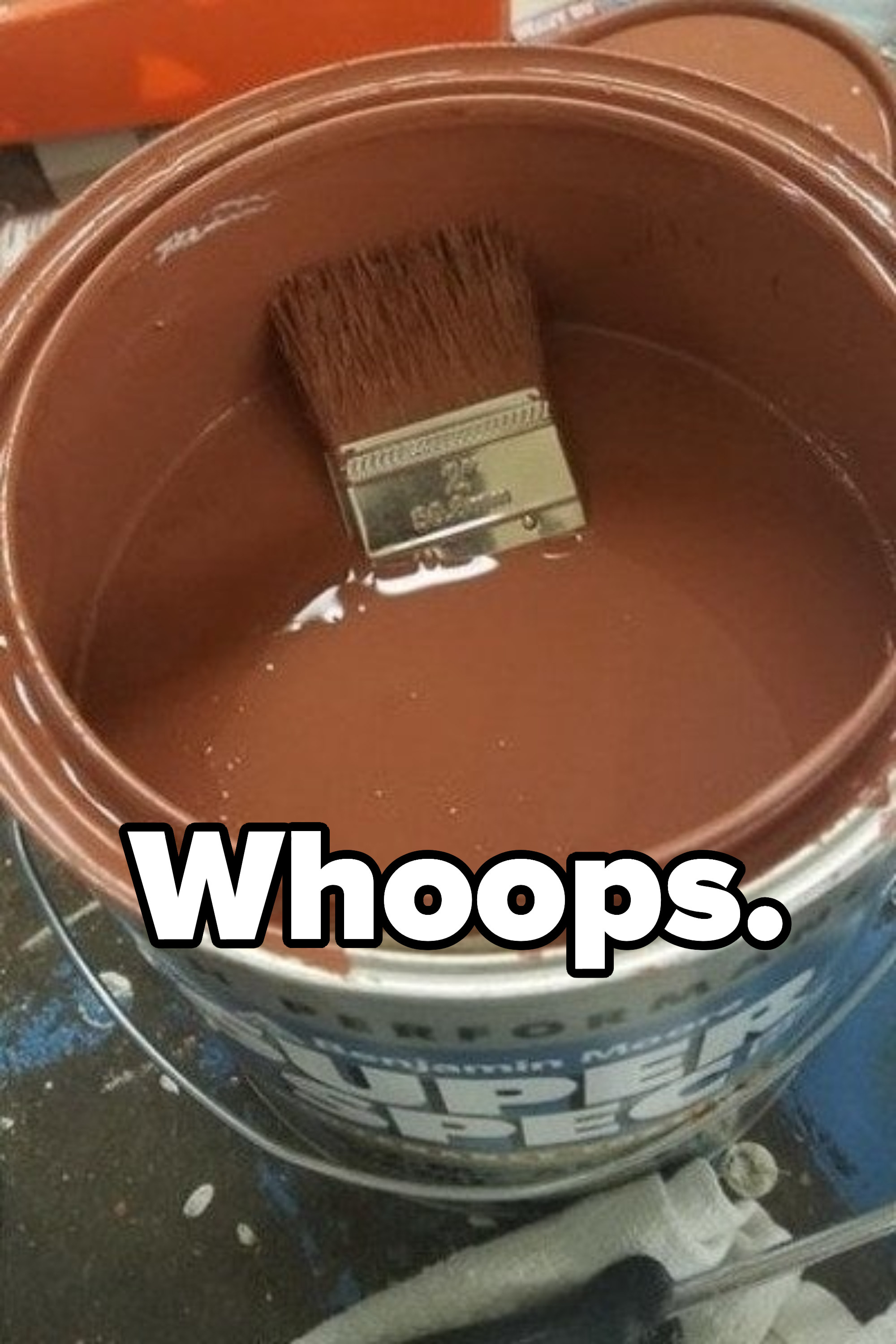 &quot;Whoops&quot; with a paintbrush drowning in a paint can
