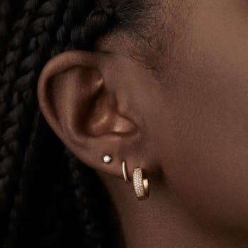 A model wearing the earrings
