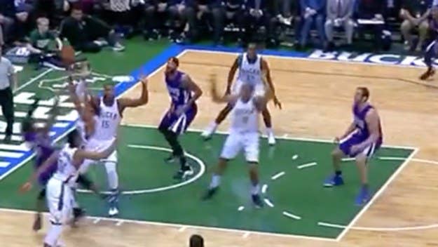 Sacramento Kings point guard Rajon Rondo throws a sick assist off the backboard.