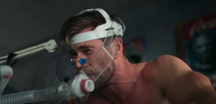 Chris Hemsworth on an exercise bike, running tests with scientists