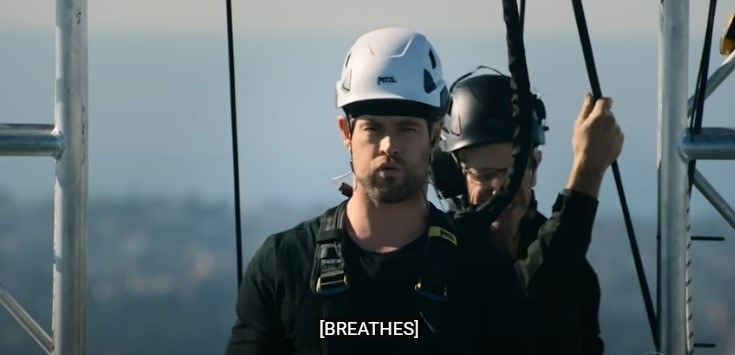 Chris Hemsworth breathing out, with an intense expression