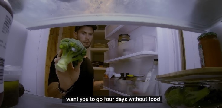 Chris Hemsworth putting broccoli back in his fridge