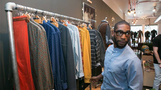 The English rapper swings by the SoHo pop-up shop to check out the brand's new Alpha Collection.