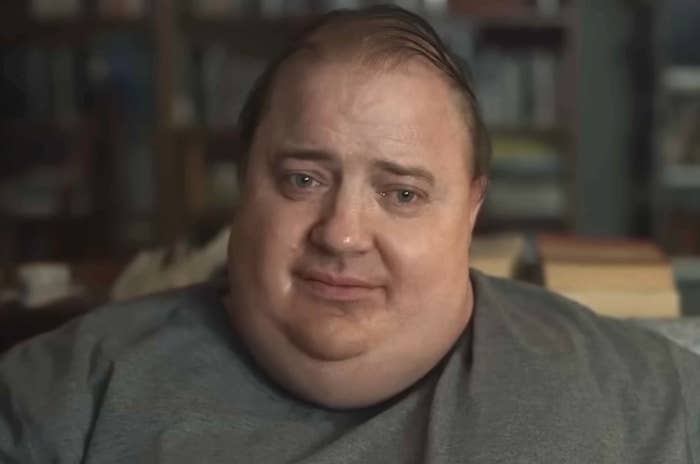 Brendan Fraser as Charlie, a 600 pound man, sitting on a sofa staring off into the distance