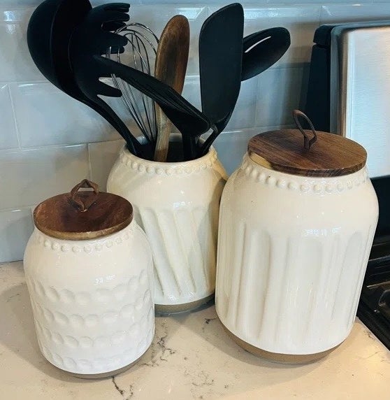 Three cannisters on a kitchen counter
