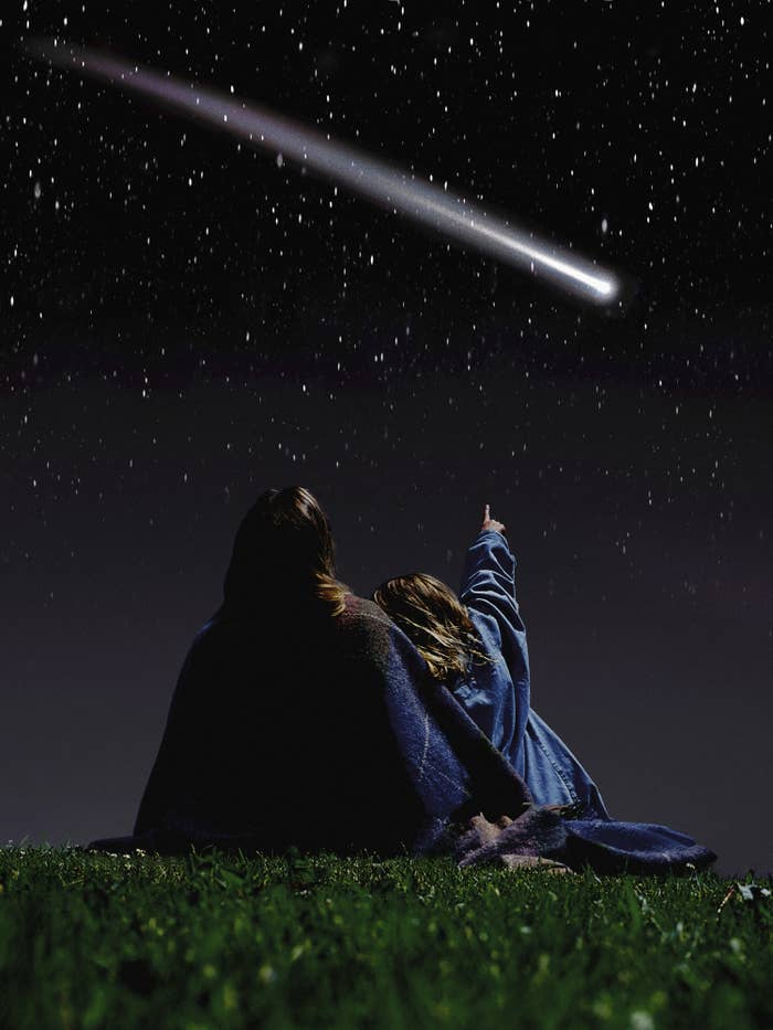 People watching a shooting star or comet