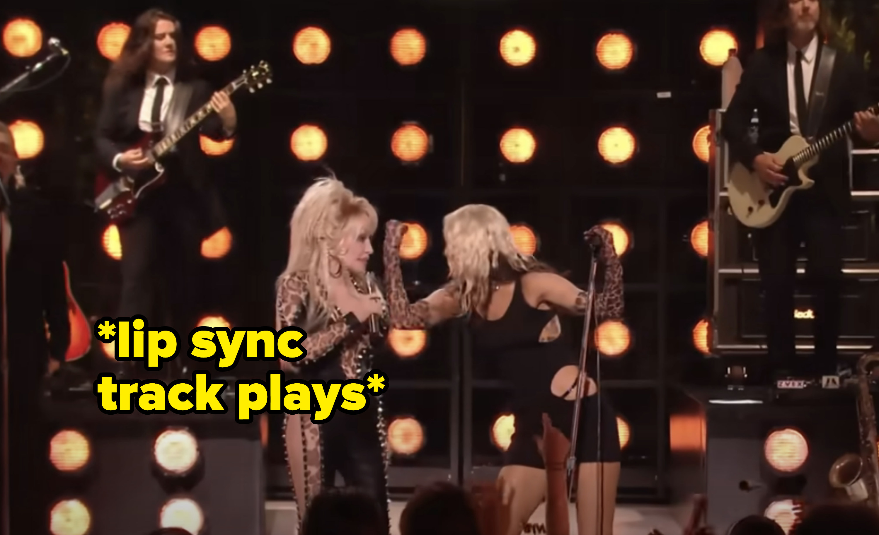 Dolly and Miley onstage with caption &quot;Lip sync track plays&quot;