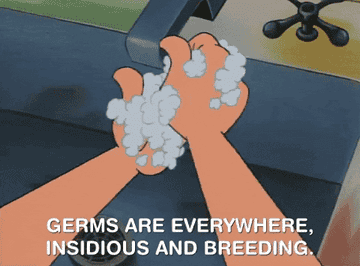 a clip of a cartoon washing their hands with the words germs are everywhere insidious and breeding written underneath from nickelodeon&#x27;s show hey arnold