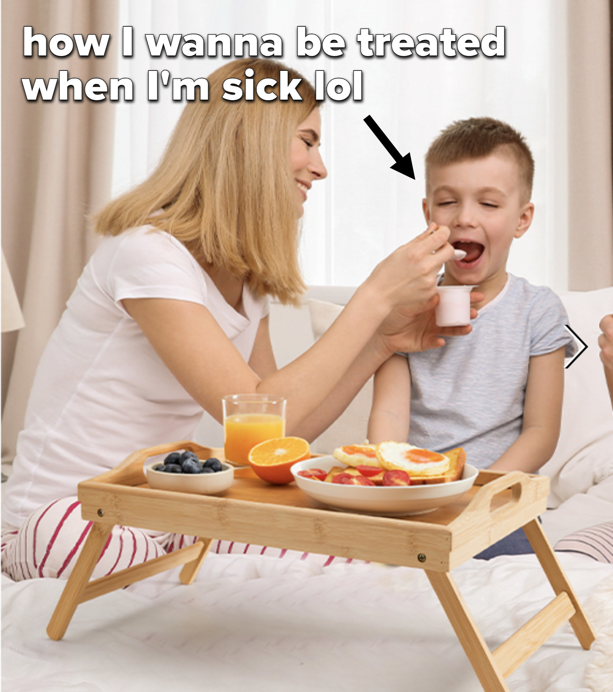 an adult and child using the breakfast tray in bed