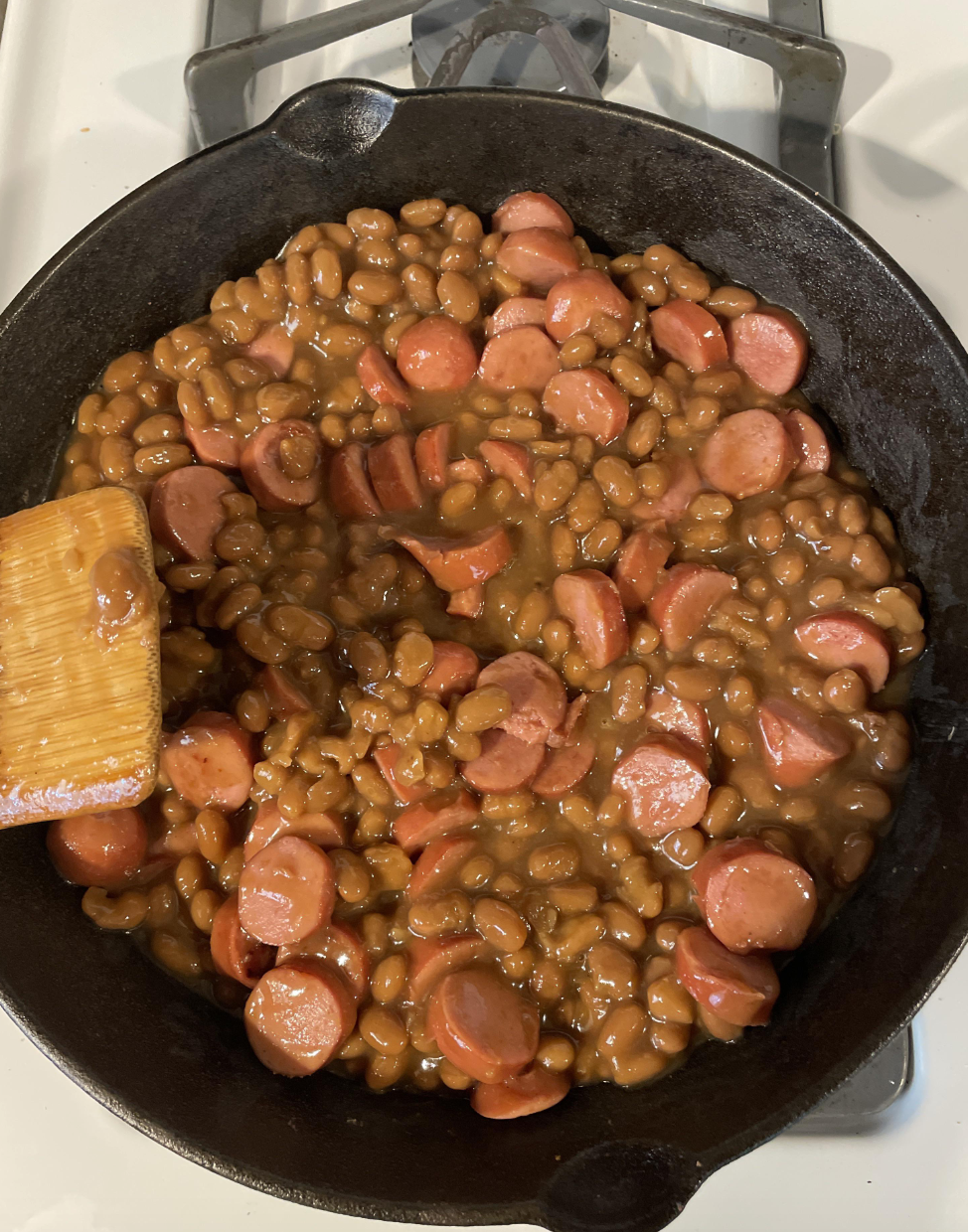 Hot dogs and beans in a pan