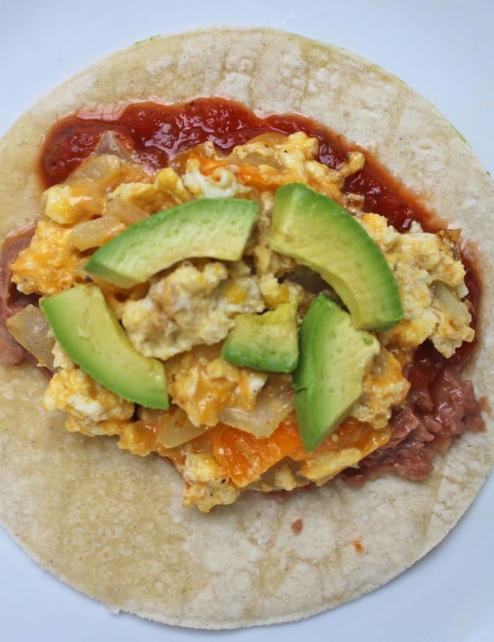Scrambled egg tacos with salsa and avocado